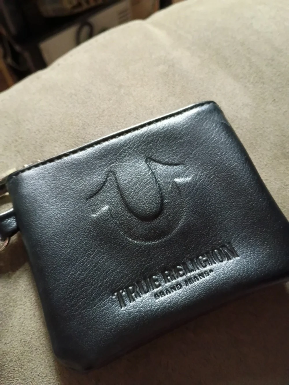 True Religion Black Leather Men's Bi-Fold Wallet with Embossed Logo
